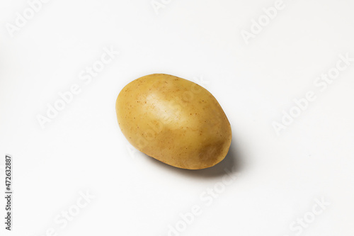 ripe potato on white background