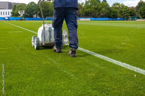 marking the boundaries of the football stadium in white photo