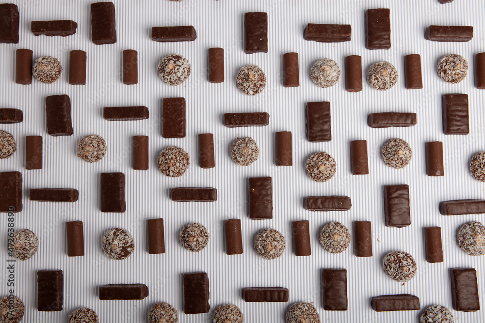 Fototapeta premium Assortment of delicious chocolate candies background. Chocolate candy isolated 