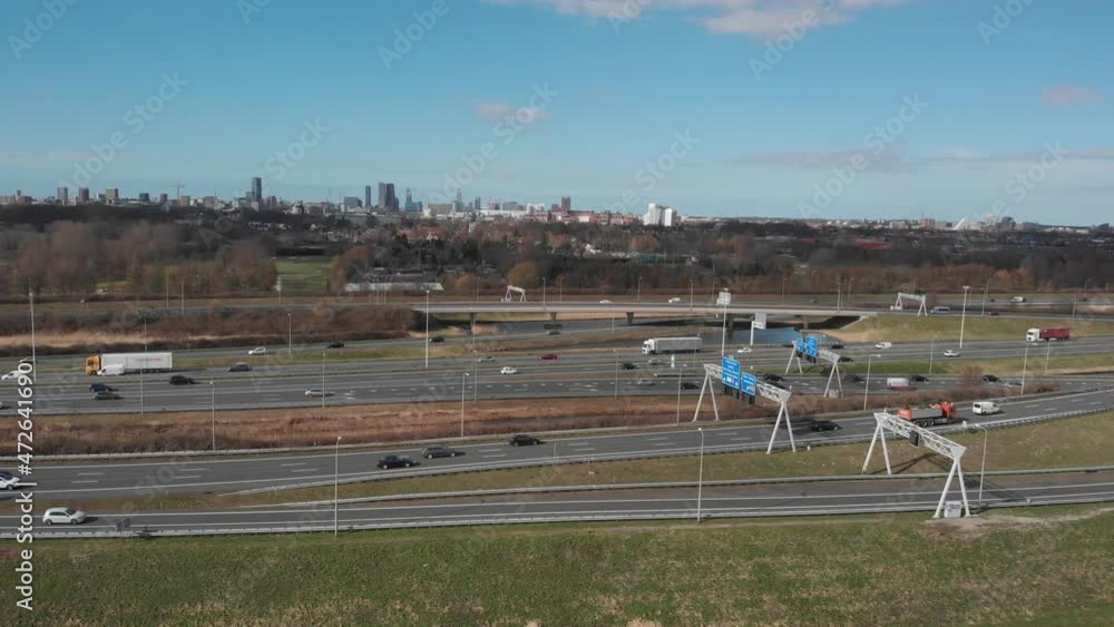 traffic on the motorway with The Hague skyline in the background; The Hague, Netherlands traffic on the motorway with The Hague skyline in the background; The Hague, Netherlands