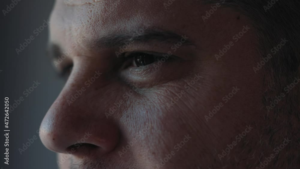 Extreme facial close up mature caucasian middle aged man 40s male eyes with wrinkles looking in distance out window thinking dreaming, enjoying good eyesight after successful laser correction operatio Extreme facial close up mature caucasian middle aged man 40s male eyes with wrinkles looking in distance out window thinking dreaming, enjoying good eyesight after successful laser correction operatio