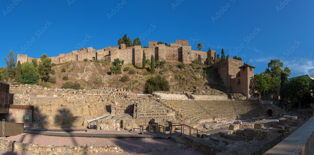 Panoramic view at the Roman Theater of Malaga and Malaga Alcazaba , an Moorish-style medieval fortress overlooking the sea