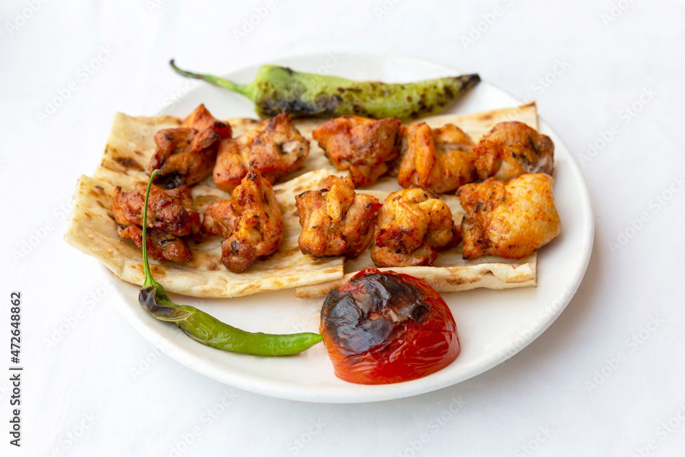 grilled chicken shish kebab with pepper and tomato
