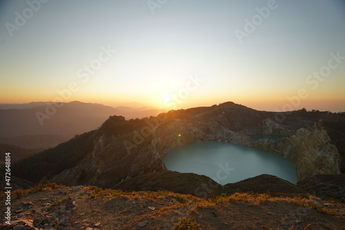 Enjoying sunrise on the top of Kelimutu National Park mountain © Rizqi