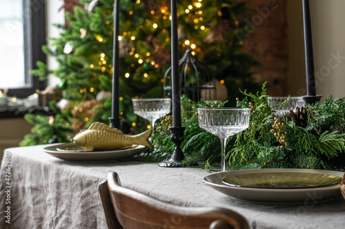 Festive christmas table setting with champain glasses. Restaraunt menu photo