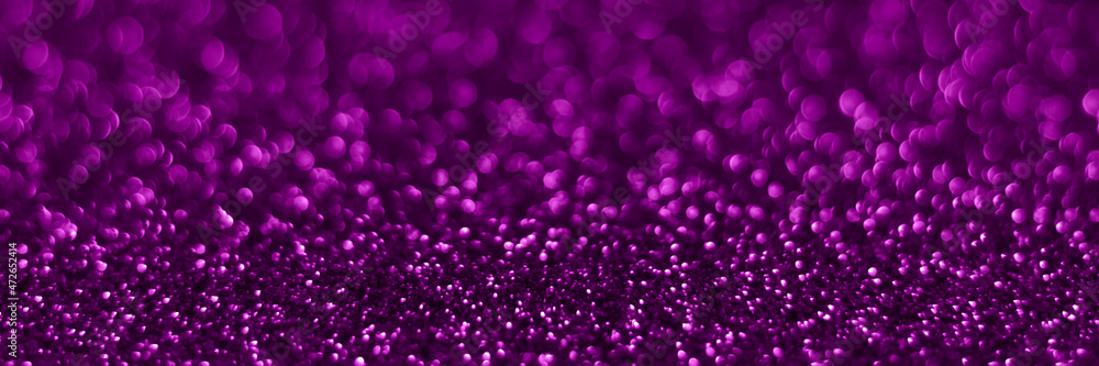 Velvet violet sparkling glitter background, christmas texture. Holiday lights. Abstract defocused header. Wide screen wallpaper. Panoramic web banner with copy space for design