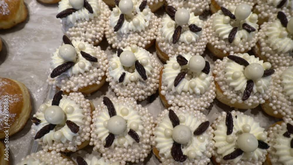 Puffed doughnuts with pink and decorations for the Hannukah holiday Puffed doughnuts with pink and decorations for the Hannukah holiday