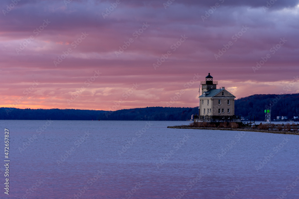 Kingston, NY - USA -Nov. 27, 2021: Horizontal sunrise view of the historic Rondout Light, a lighthouse on the west side of the Hudson River at Kingston, New York.