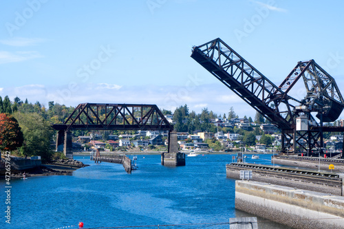 Seattle, WA - USA - Sept. 23, 2021: View of Salmon Bay Bridge, also known as Bridge No. 4, a Strauss Heel-trunnion single-leaf bascule bridge. Located west of the Hiram M. Chittenden Locks. photo