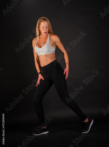 Female fitness model posing in various outfits.