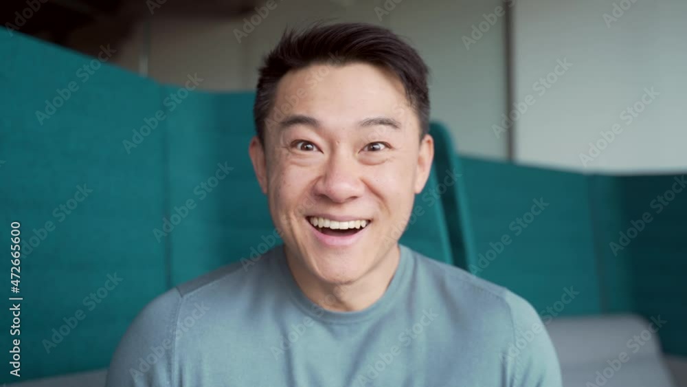 surprised asian man shoots glasses shocked looking at camera. Happy smiling rejoices. Look at monitor screen webcam view. amazed close up portrait. Face Handsome man Office worker wow expression surprised asian man shoots glasses shocked looking at camera. Happy smiling rejoices. Look at monitor screen webcam view. amazed close up portrait. Face Handsome man Office worker wow expression