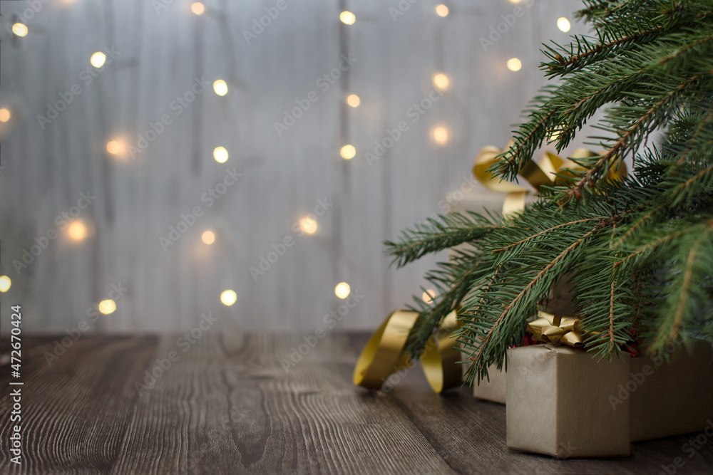 Christmas background. Gifts under the Christmas tree. Wooden floor covering. Garland lights in the background. Christmas mood. High quality photo Christmas background. Gifts under the Christmas tree. Wooden floor covering. Garland lights in the background. Christmas mood. High quality photo