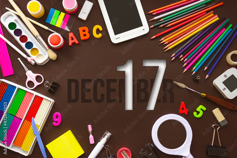 December 17th. Day 17 of month, Calendar date. School notebook and various stationery with calendar day. School and office supplies frame. Winter month, day of the year concept. December 17th. Day 17 of month, Calendar date. School notebook and various stationery with calendar day. School and office supplies frame. Winter month, day of the year concept.