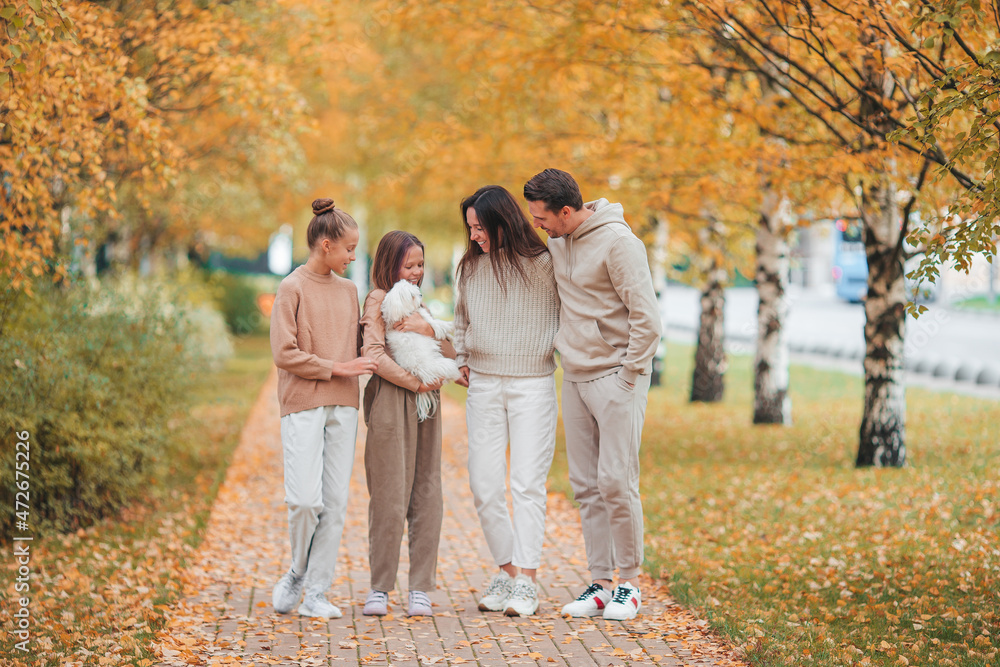 Portrait of happy family of four in autumn Portrait of happy family of four in autumn