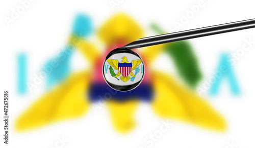 Vaccine syringe with drop on needle against national flag of Virgin Islands US background. Medical concept vaccination. Coronavirus Sars-Cov-2 pandemic protection. National safety idea.