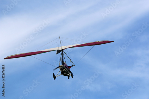 Valokuva Ultralight airplane flying in a blue sky
