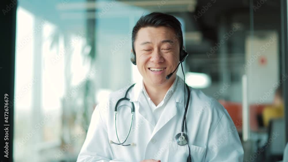 online consultation with a doctor or a patient conference with colleagues. Asian male medic therapist advice online treatment. communicates talking and looking at camera. webcam view. Telemedicine online consultation with a doctor or a patient conference with colleagues. Asian male medic therapist advice online treatment. communicates talking and looking at camera. webcam view. Telemedicine