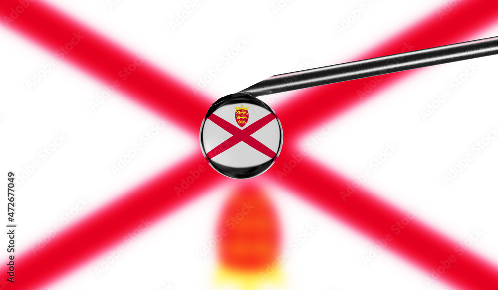 Vaccine syringe with drop on needle against national flag of Jersey background. Medical concept vaccination. Coronavirus Sars-Cov-2 pandemic protection. National safety idea.