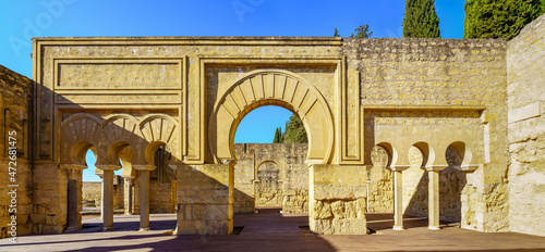 Ruins of medieval arabic palace with columns and arched doors. Cordoba Medina Azahara. photo