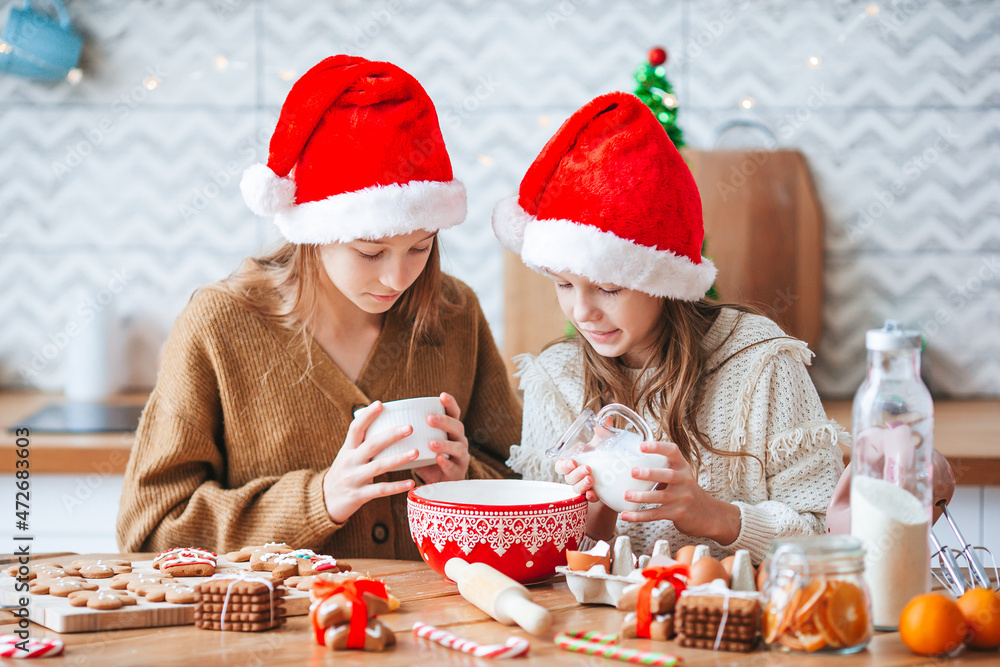 Little girls preparing Christmas gingerbread at home Little girls preparing Christmas gingerbread at home