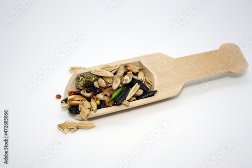 Wallpaper Mural Food for rodents or birds in a wooden spoon on a white background. Torontodigital.ca