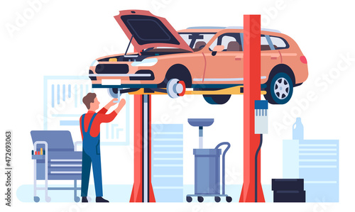 Car lifted for maintenance workshop. Man repairing vehicle
