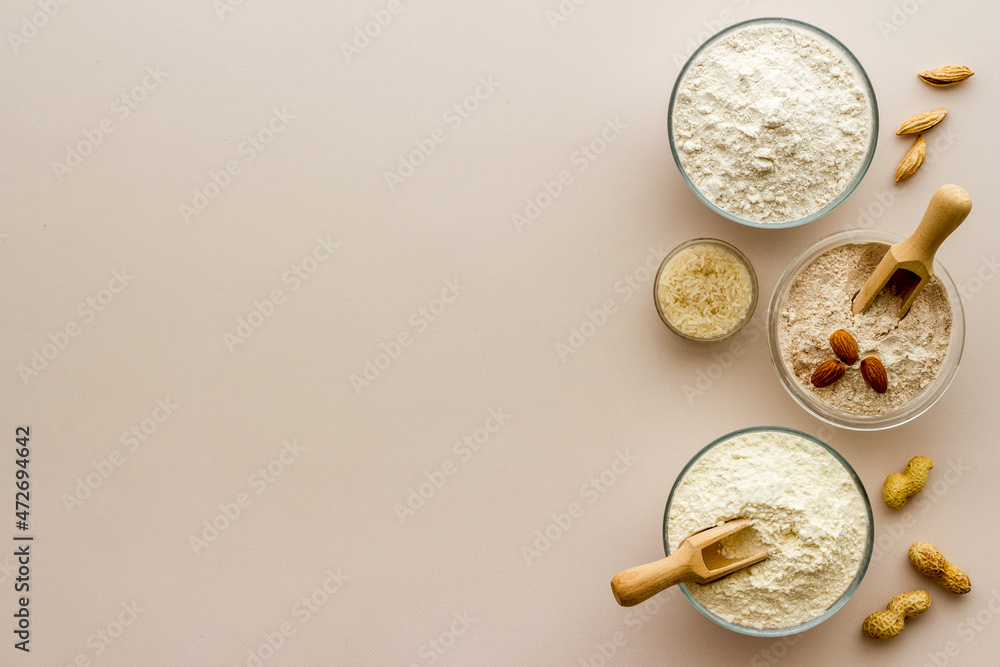 Gluten free flour for baking - nuts and grains flour in many bowls Gluten free flour for baking - nuts and grains flour in many bowls