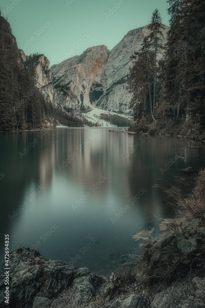landscape of a lake between mountains with boats landscape of a lake between mountains with boats