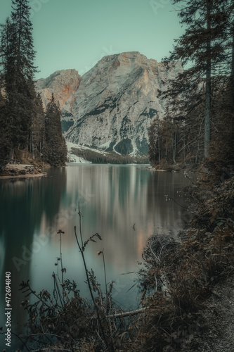 landscape of a lake between mountains with boats