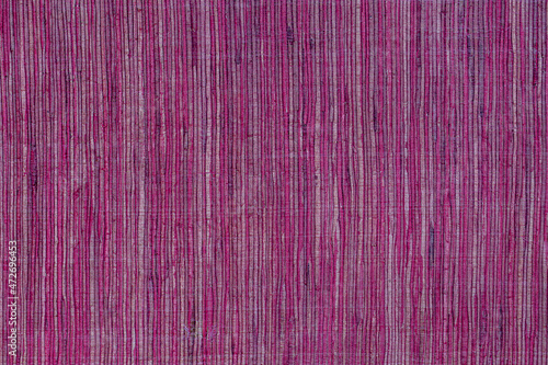 Detail of burgundy woven fabric as background or texture