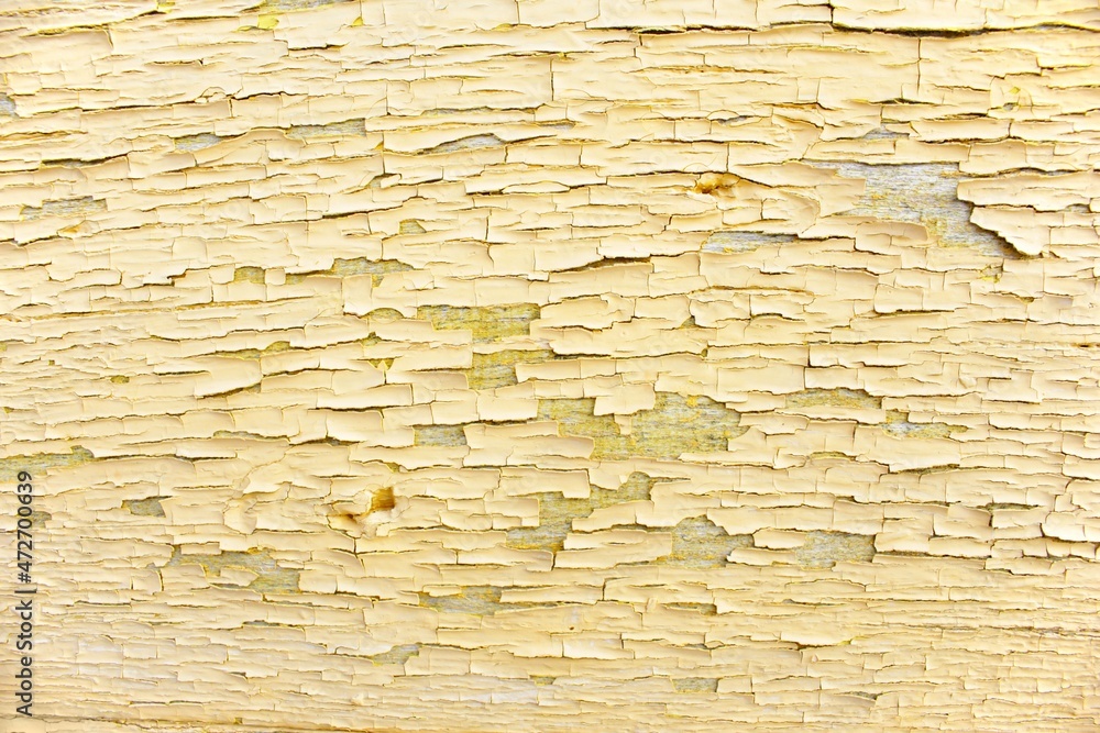Obraz premium Old shabby yellow painted wooden board background