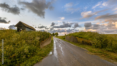 Foto Road passage through old sea dike