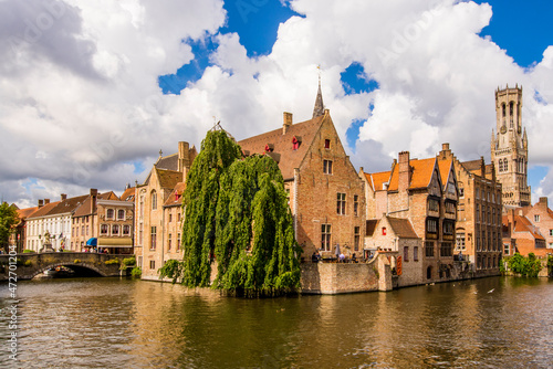Rozenhoedkaai canal with Belfort tower, Bruges, West Flanders, Belgium.