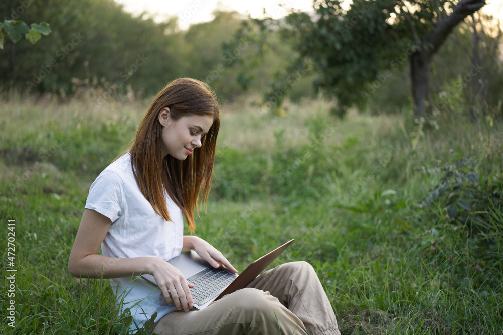 women outdoors in field with laptop leisure technology freedom women outdoors in field with laptop leisure technology freedom