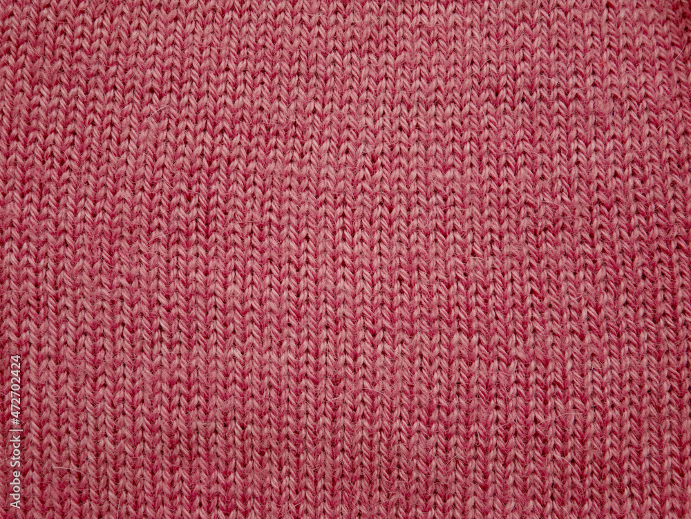 Texture of pink fabric, close up of wool structure, wallpaper background. Texture of pink fabric, close up of wool structure, wallpaper background.