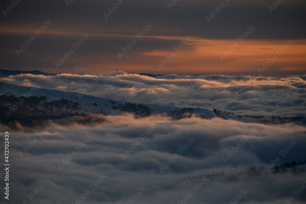 Wonderful aerial view of picturesque scene of sky and white clouds and winter mountain landscape Wonderful aerial view of picturesque scene of sky and white clouds and winter mountain landscape