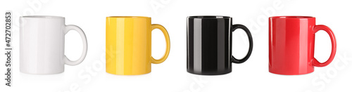 Set with different ceramic mugs on white background. Banner design photo