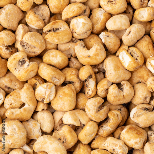 Top view, closeup of canjica, hominy or white corn popcorn, sweet popcorn photo