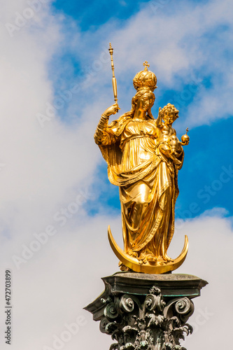 The golden Virgin Mary column in the Mariensaule main square  Munich  Bavaria  Germany.