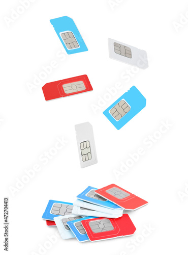 Many different SIM cards falling on white background