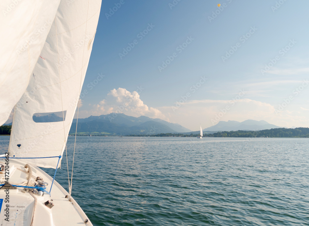 Obraz premium Sailing on lake Chiemsee. Lake Chiemsee in the Chiemgau. The foothills of the Bavarian Alps in Upper Bavaria, Germany