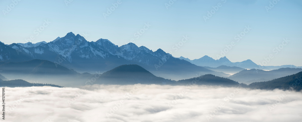 View from Mount Hoernle over a sea of fog hiding the valley of river Ammer towards Fuessen. Bavarian alps near Unterammergau in the Werdenfelser Land (Werdenfels county). Europe, Germany, Bavaria