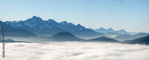 View from Mount Hoernle over a sea of fog hiding the valley of river Ammer towards Fuessen. Bavarian alps near Unterammergau in the Werdenfelser Land (Werdenfels county). Europe, Germany, Bavaria © Danita Delimont