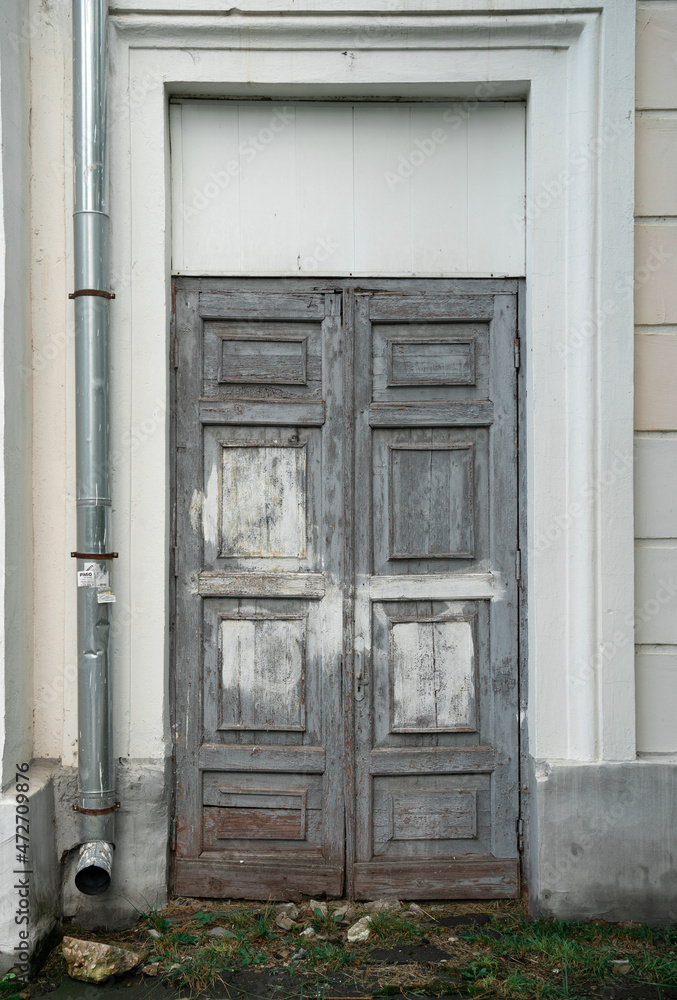 old doors to the entrance of the house