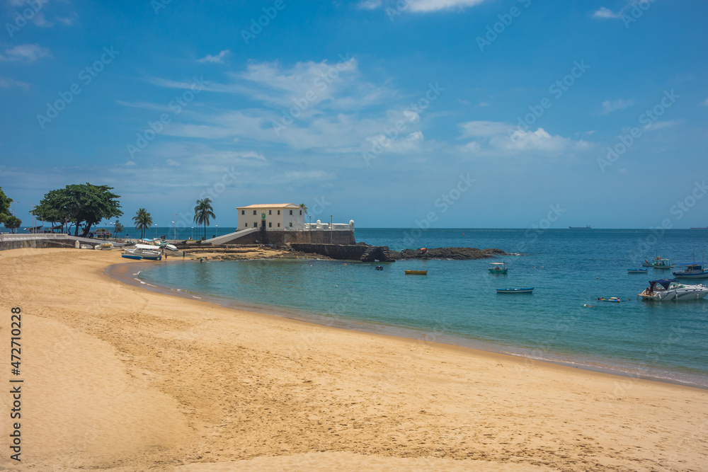 View of the beautiful and famous Porto da Barra beach with Saint Mary Fort (Forte de Santa Maria) in the distance - Salvador, Bahia, Brazil