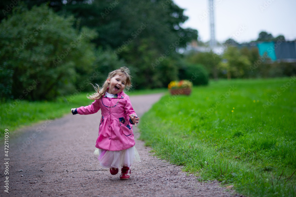 little child walking in the park little child walking in the park