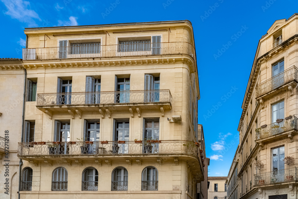 Nimes in Franc, old facades in the historic center, typical buildings
