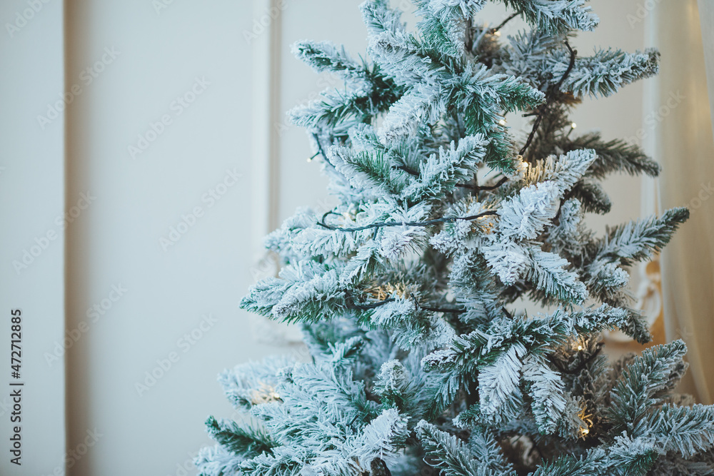 Christmas background. Christmas tree with toys and garlands.