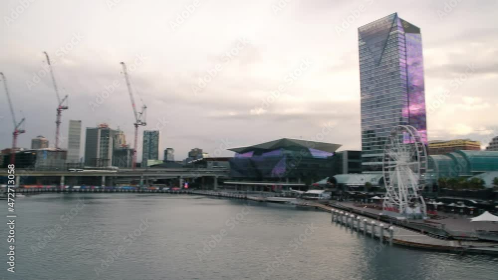 SYDNEY, AUSTRALIA - AUGUST 19, 2018: Panoramic view of Darling Harbour with tourists on a sunny day SYDNEY, AUSTRALIA - AUGUST 19, 2018: Panoramic view of Darling Harbour with tourists on a sunny day
