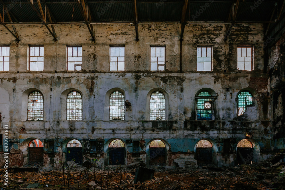 Wall with vaulted windows in abandoned and ruined sugar factory